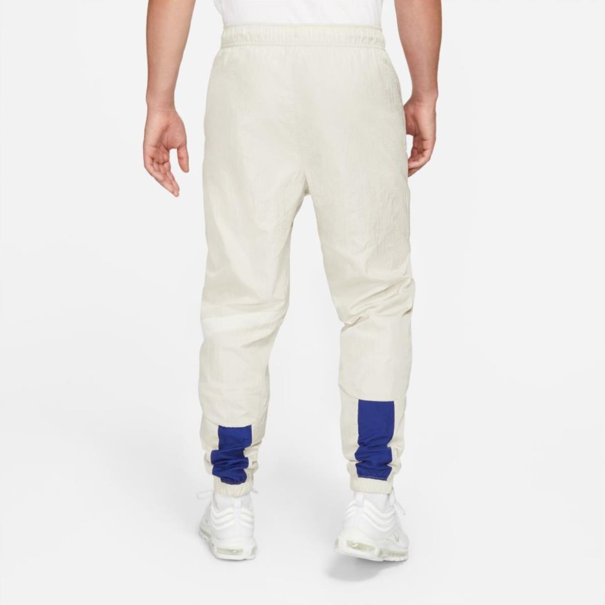 PANTALONE UOMO M NSW SWOOSH WVN LND PANT
