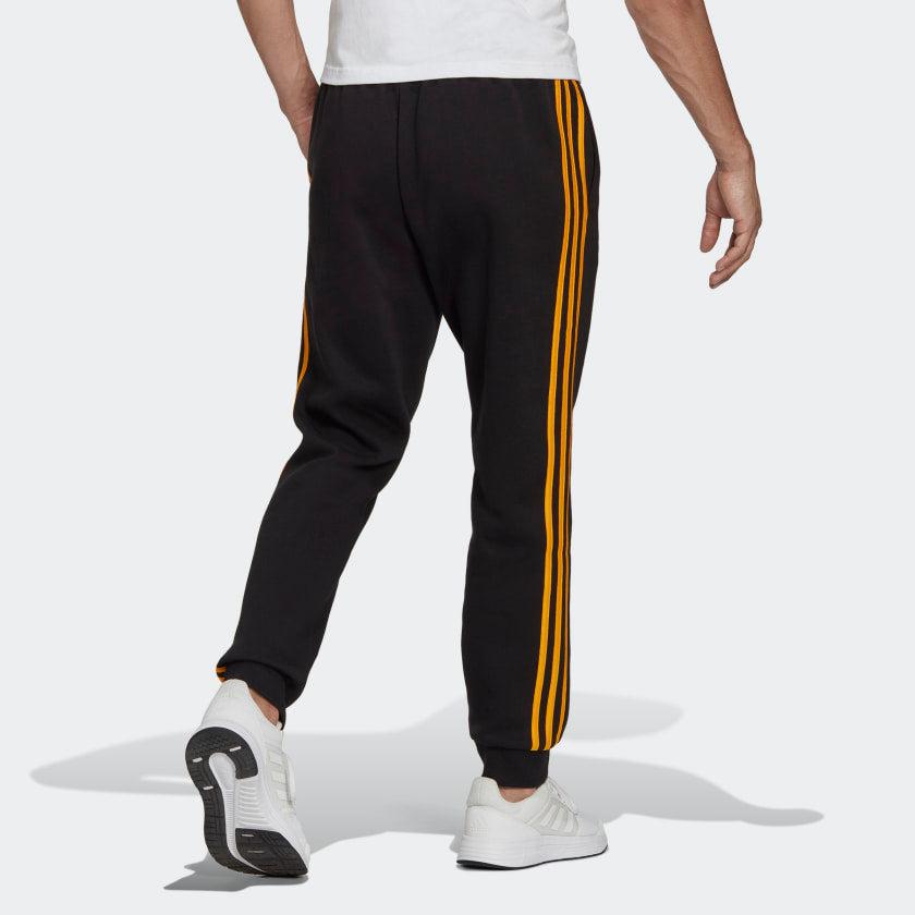 PANTALONI ESSENTIALS FRENCH TERRY CON POLSINI AFFUSOLATI E 3 STRISCE - Azzollino
