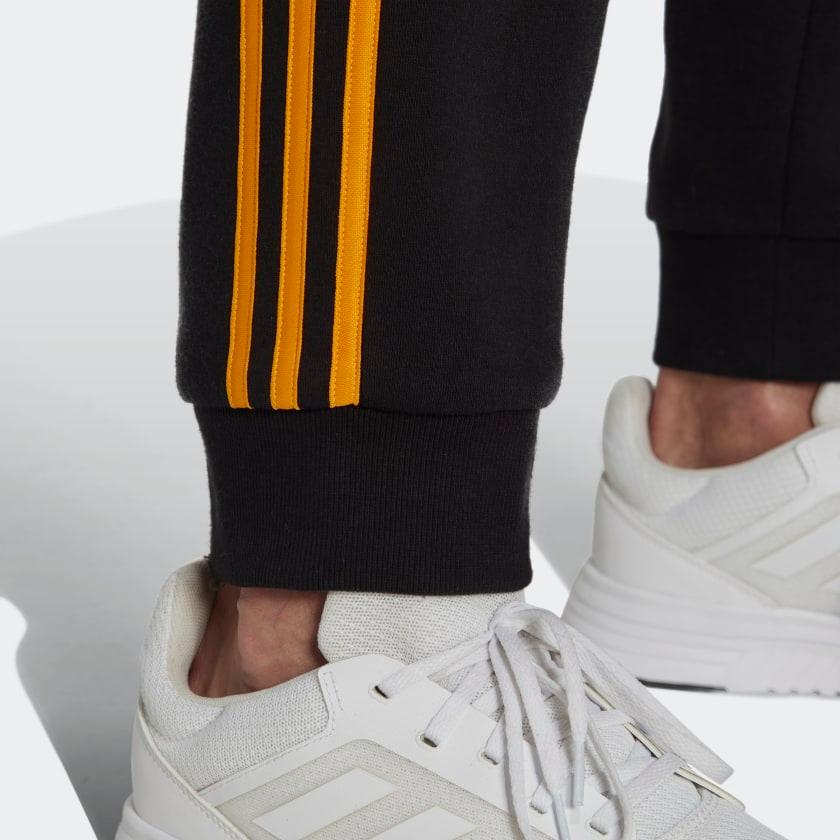 PANTALONI ESSENTIALS FRENCH TERRY CON POLSINI AFFUSOLATI E 3 STRISCE - Azzollino