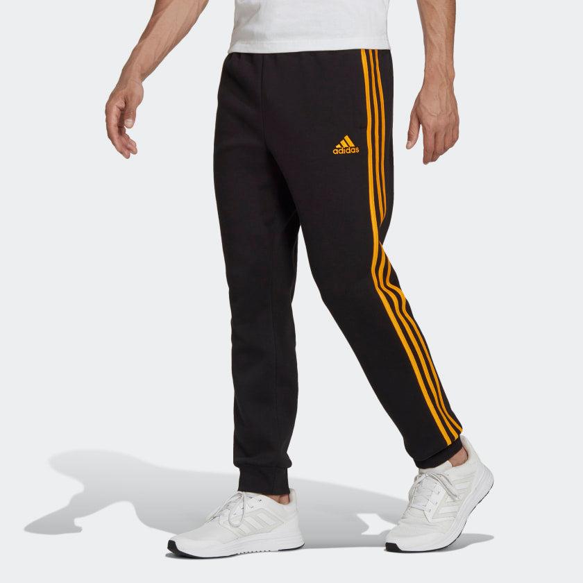 PANTALONI ESSENTIALS FRENCH TERRY CON POLSINI AFFUSOLATI E 3 STRISCE - Azzollino